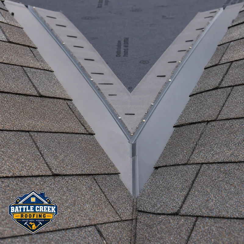 Detail of a properly installed roof valley with underlayment and neatly aligned shingles